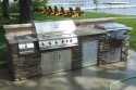 All masonry – grill, side burner, ice bin, trash, storage. Concrete countertop