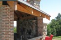 Raised bar with sink and space for a fridge. Brick match the other buildings on the property